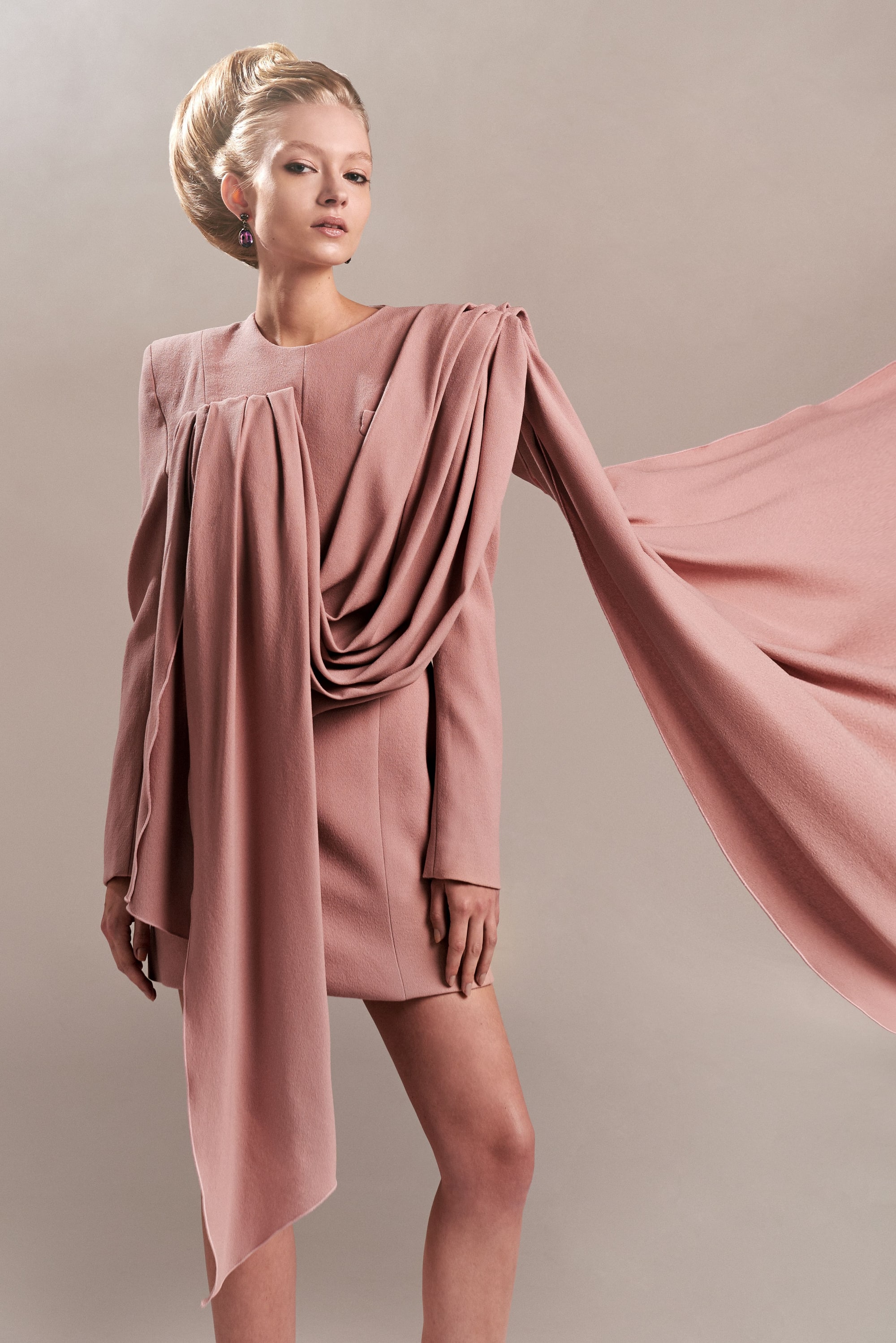Nikita Lauffer in a draped dress with a flowing sash