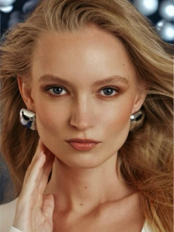 Nikita Lauffer in a close portrait with silver earrings