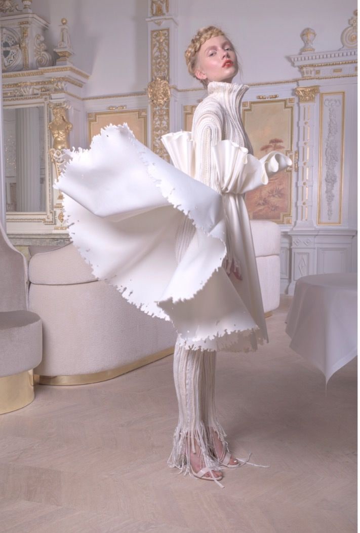 Nikita Lauffer in a white ruffled gown