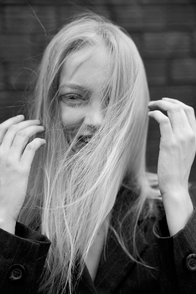 Nikita Lauffer laughing, hair across her face